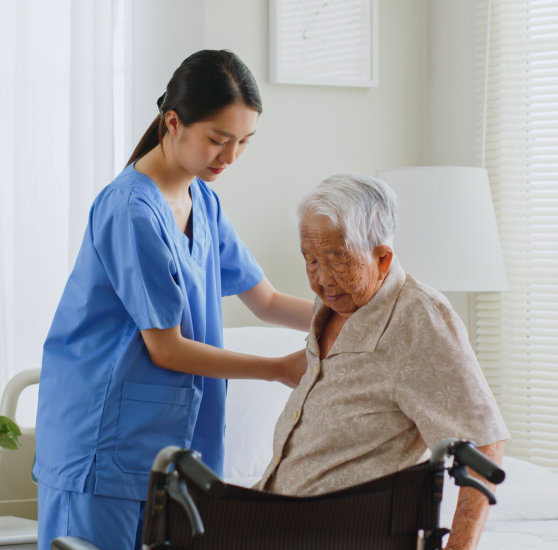 Care worker helping a senior woman