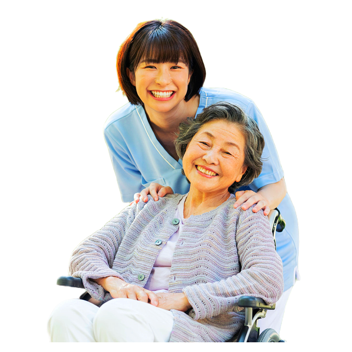 Care worker holding the shoulder of senior woman in a wheelchair
